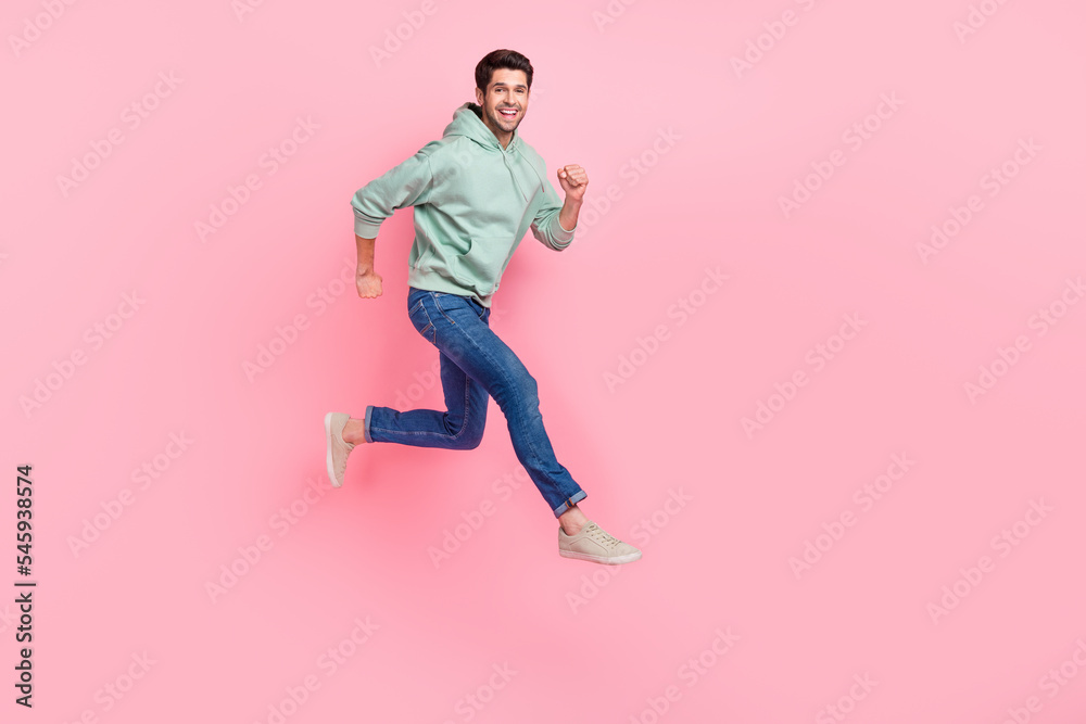 Full length photo of cheerful positive boy trendy comfort clothes go empty space low price black friday isolated on pink color background Full length photo of cheerful positive boy trendy comfort clothes go empty space low price black friday isolated on pink color background