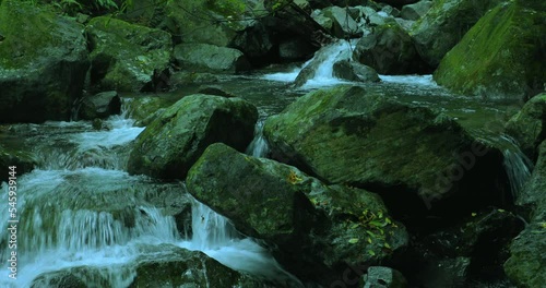 In the emerald valley flows a cool and clear stream