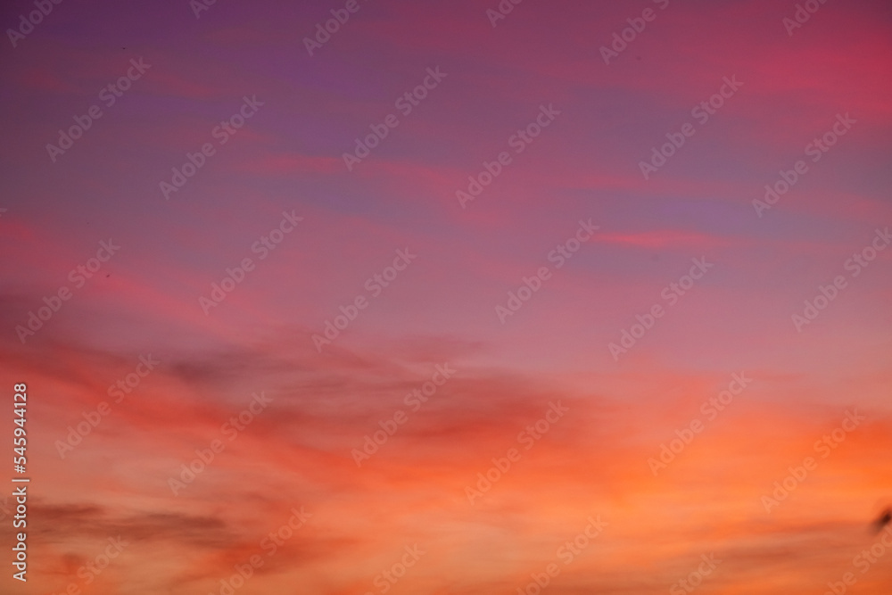 beautiful gradient orange clouds and sunlight on the blue sky perfect for the background, take in everning,Twilight