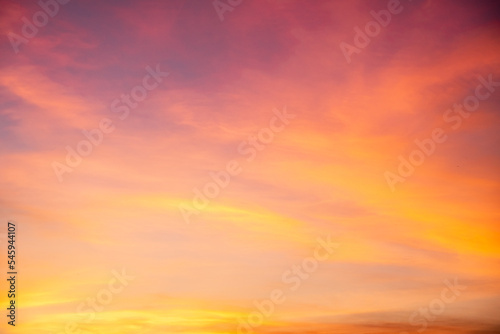 beautiful gradient orange clouds and sunlight on the blue sky perfect for the background, take in everning,Twilight