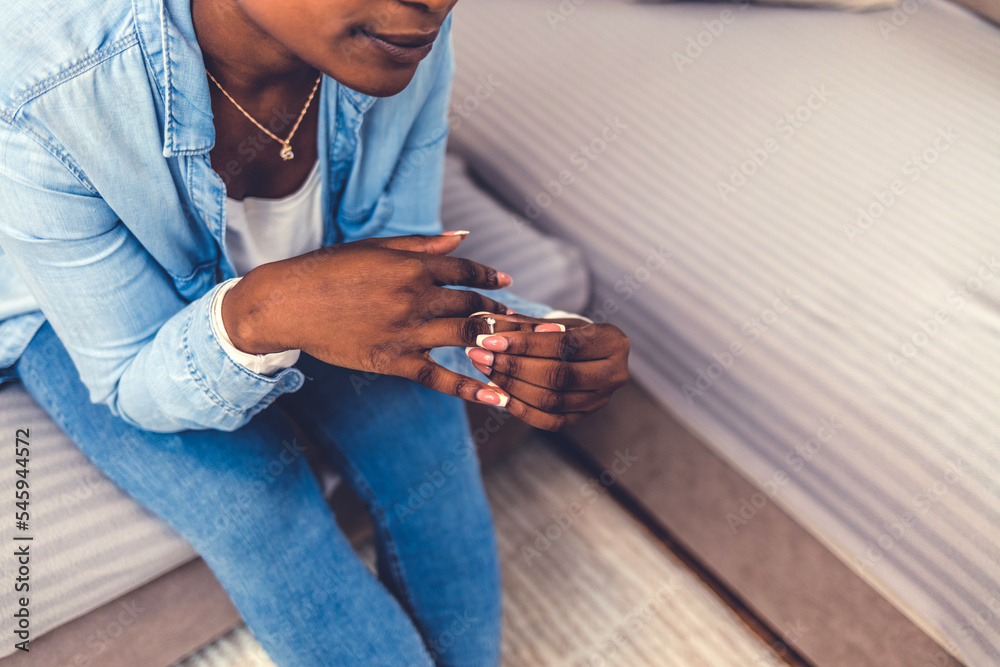 Φωτογραφία Upset African American girl hold wedding ring cry depressed with divorce, marriage dissolution, unhappy sad black young woman feel desperate breaking up