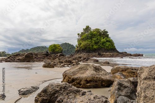 Girl walking on a beach on the coast of the Pacific Ocean in Costa Rica. Manuel Antonio Park