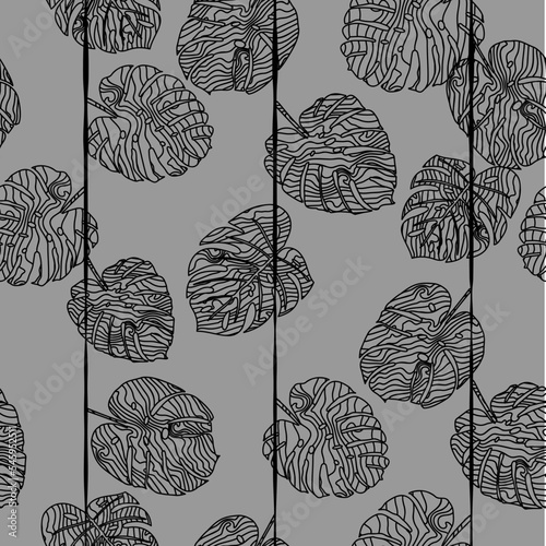 Black and white seamless pattern of abstract monstera leaves.