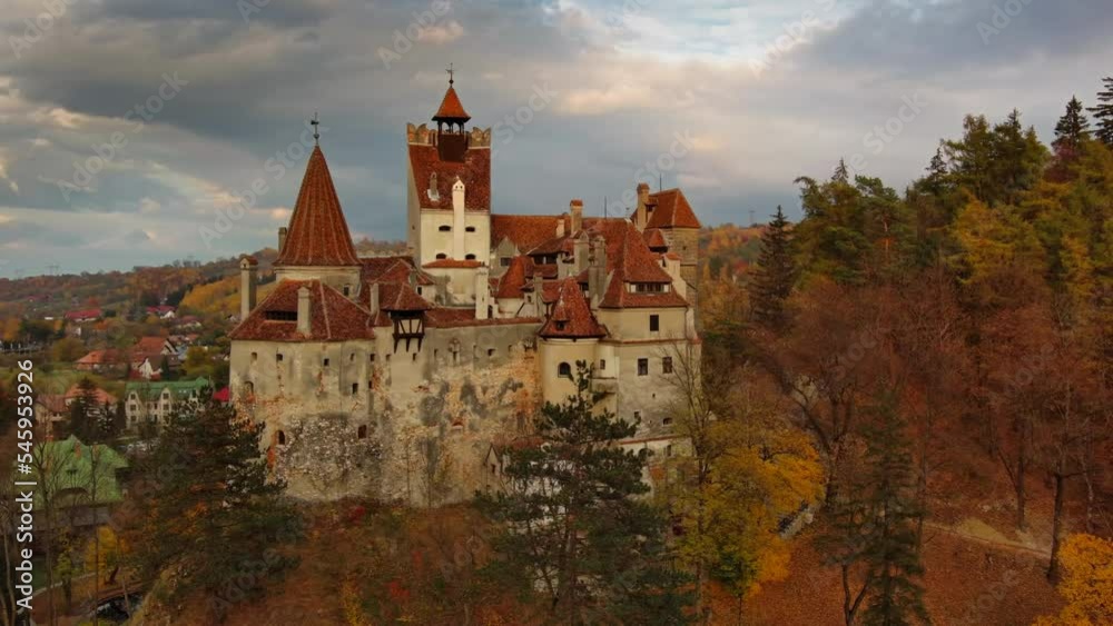 Aerial around view of Bran castle in Transylvania region, Romania. Autumn season and dark clouds, 4k Aerial around view of Bran castle in Transylvania region, Romania. Autumn season and dark clouds, 4k