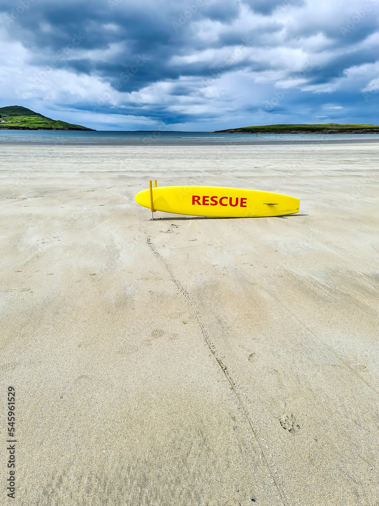Yellow coast guard rescue surfboard at Narin Beach by Portnoo, County Donegal - Ireland Yellow coast guard rescue surfboard at Narin Beach by Portnoo, County Donegal - Ireland