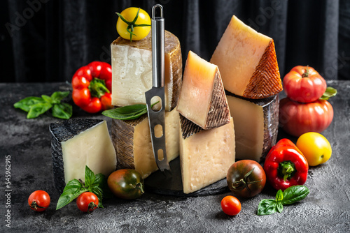 Cheese board of various types of soft and hard cheese. spanish manchego cheese, International dairy delicacies. photo