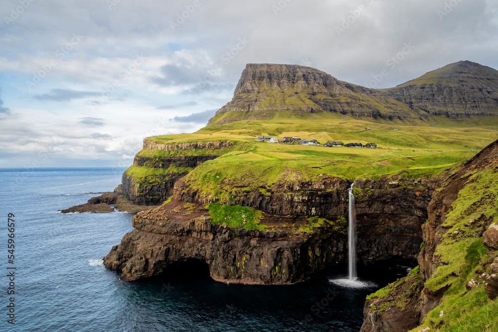 A long exposure of the Mulafossur waterfall, Vagar, Faroe Island. A long exposure of the Mulafossur waterfall, Vagar, Faroe Island.