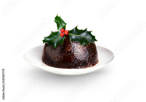 A traditional festive fruit Christmas steamed pudding with holly on the top isolated against a transparent background. photo