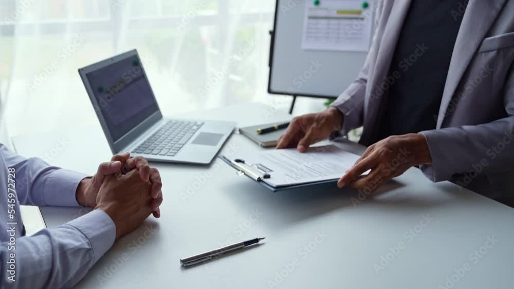 Businessman having an interview for a job, Company hr reading candidate's CV, and interviewing Businessman having an interview for a job, Company hr reading candidate's CV, and interviewing