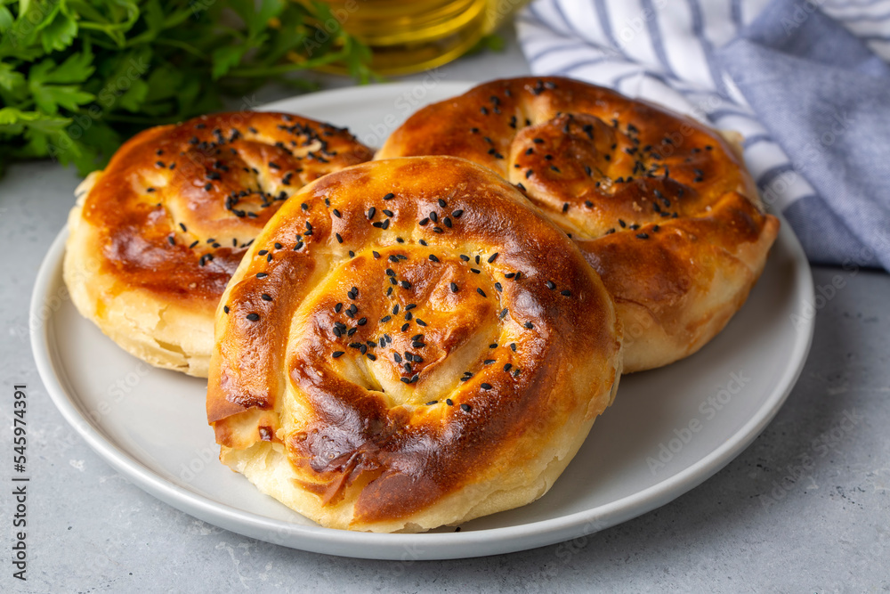 Traditional delicious Turkish phyllo stuffed with spinach, cheese (Turkish name; Gul borek or gul boregi) Rose shaped pastry. Traditional delicious Turkish phyllo stuffed with spinach, cheese (Turkish name; Gul borek or gul boregi) Rose shaped pastry.