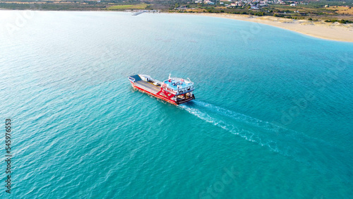 Greek Island Beauty: Aerial view of a ferry boat in turquoise waters 
