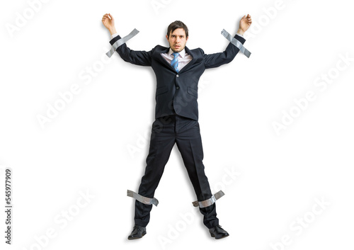 Businessman in suit is taped to the wall with adhesive tape. Isolated on transparent background.