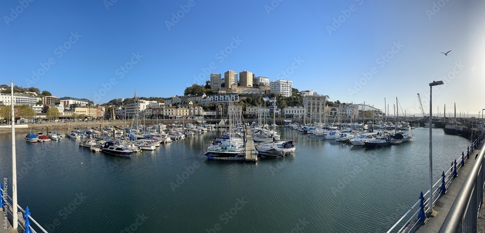 Panoramic shot with boats in a harbour on a sunny day. Torquay, Devon, England