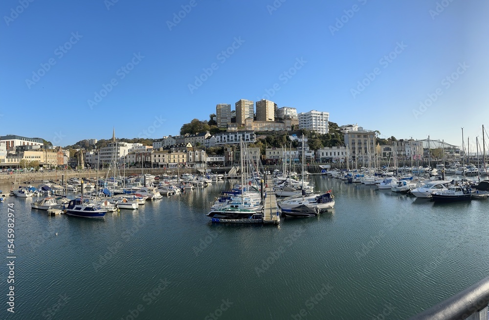 Panoramic shot with boats in a harbour on a sunny day. Torquay, Devon, England