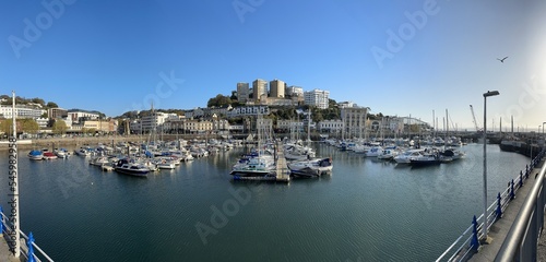 Panoramic shot with boats in a harbour on a sunny day. Torquay, Devon, England