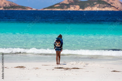 Woman in a kitty hoodie standing on the Lucky Bay beach in Western Australia