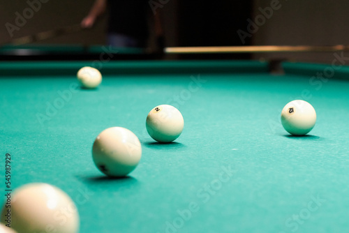 Russian billiard balls on a table with green cloth