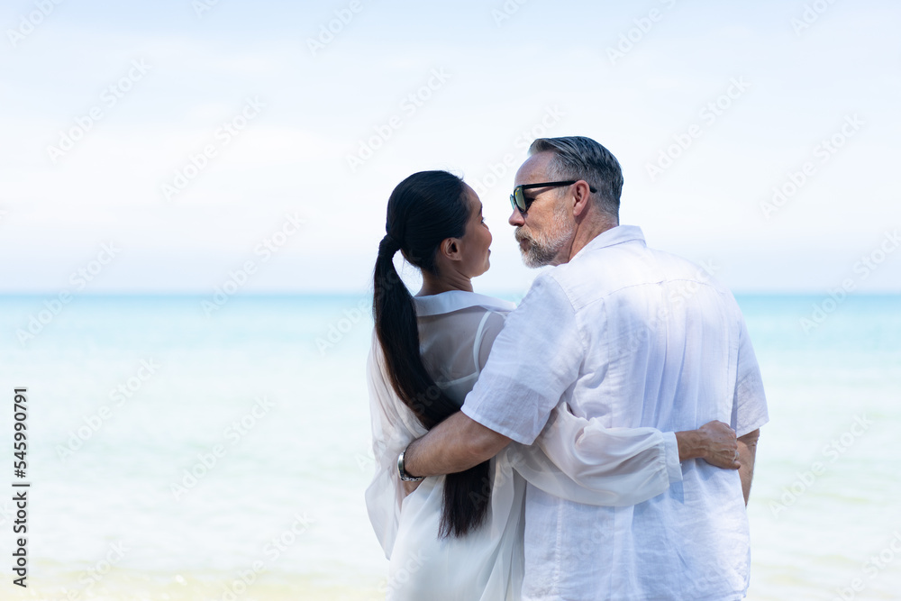 Romantic Couple Walking on the Beach. portrait of living young couple at the beach. Romantic marriage proposal at the seaside on the beach sea. Romantic marriage proposal on the beach. Romantic Couple Walking on the Beach. portrait of living young couple at the beach. Romantic marriage proposal at the seaside on the beach sea. Romantic marriage proposal on the beach.