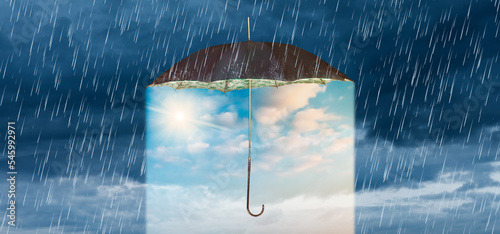 Obraz na płótnie Concept of storm and heavy rain with a vintage umbrella revealing a blue sky wit