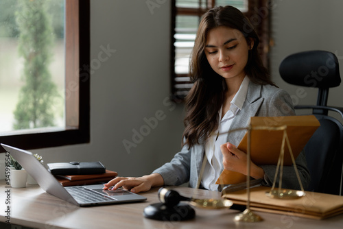 Lawyer business woman working or reading agreement contract in office workplace for consultant lawyer concept