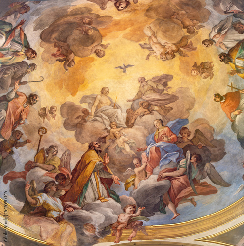 VARALLO, ITALY - JULY 17, 2022: The ceiling fresco Glory of Evangelists and St. Gaudentius in the church Collegiata di San Gaudenzio by Carlo Bartolomeo Borsetti (1702). photo
