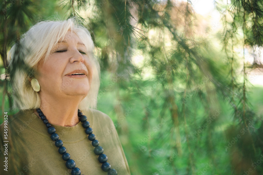 Happy elderly woman with closed eyes Happy elderly woman with closed eyes