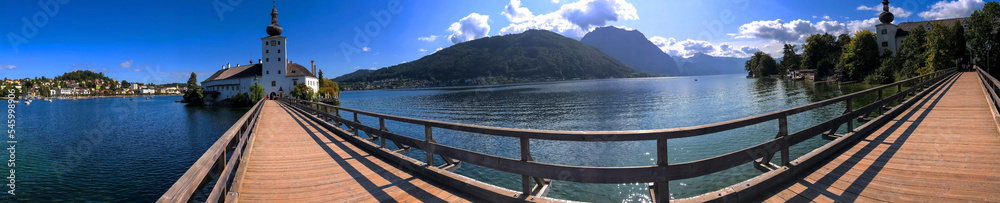 photo background panoramic view of the castle on the island in the middle of the Traunsee lake, Gmunden, Austria, Europe
