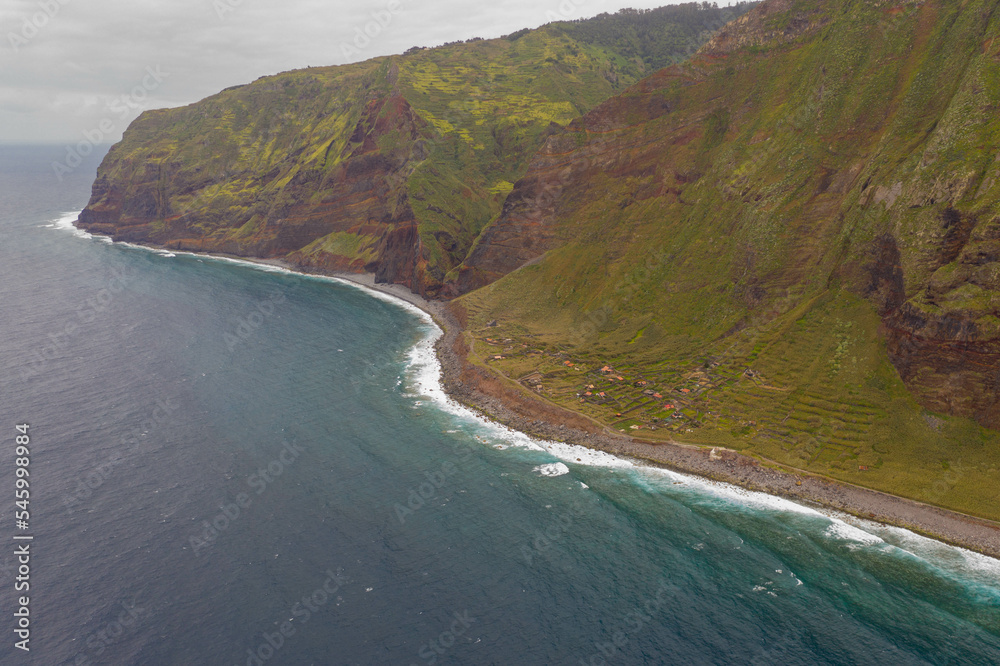 Drone view of coastline and small abandoned village Drone view of coastline and small abandoned village