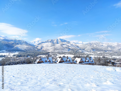Fototapeta Naklejka Na Ścianę i Meble -  Traditional mountain houses in koscielisko in winter landscape. Tatra mountains, Poland