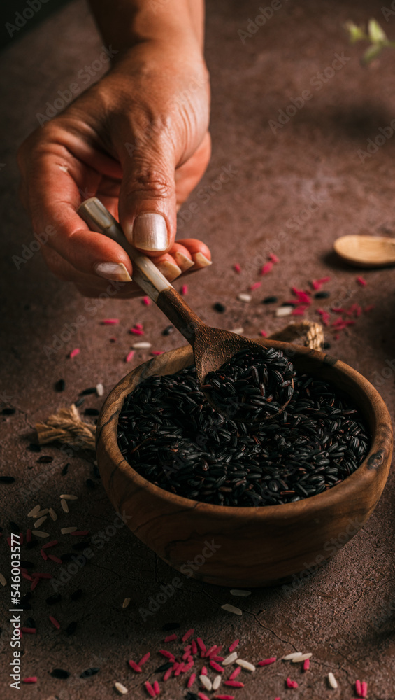 Crop woman showing black rice Crop woman showing black rice