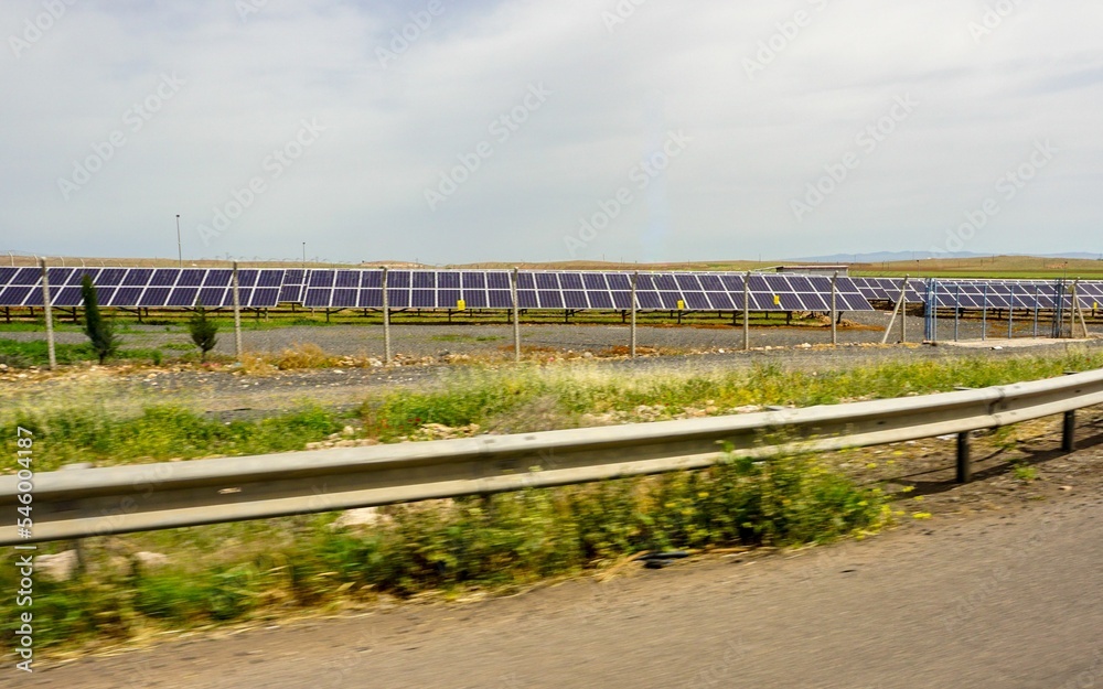 Solar power plant in a farmland captured by a highway in Turkey