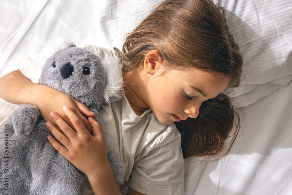 Cute little girl is sleeping on the bed. Cute little girl is sleeping on the bed.