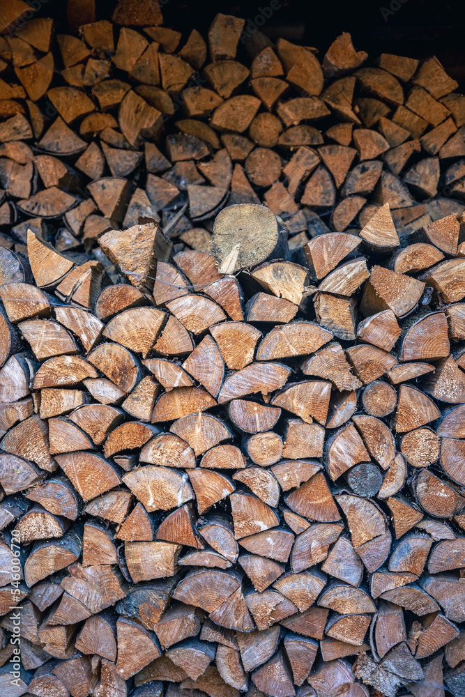 Wall of stacked wooden logs as background. Wall of stacked wooden logs as background.