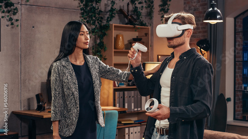 Television Sitcom Living Room: Couple Has Relationship Problems. Funny Sketch About Guy Having VR Metaverse Addiction, Girl Confronts Him. Comedy Show on Network Channel, Streaming Service. photo