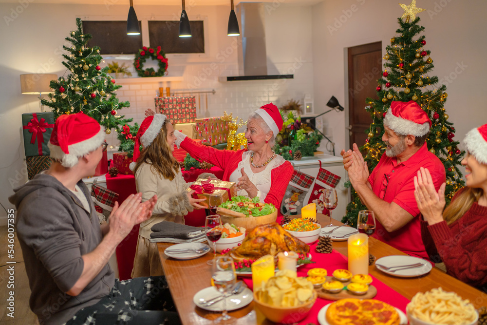 Soft focus concept and background burred. Family having a happy meal to celebrate Christmas and New Year 2023. Soft focus concept and background burred. Family having a happy meal to celebrate Christmas and New Year 2023.