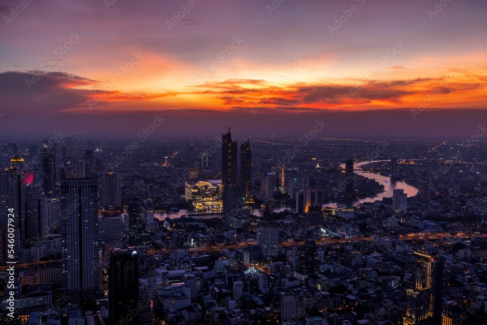 Cityscape of Bangkok city in Thailand under the purple sunset sky