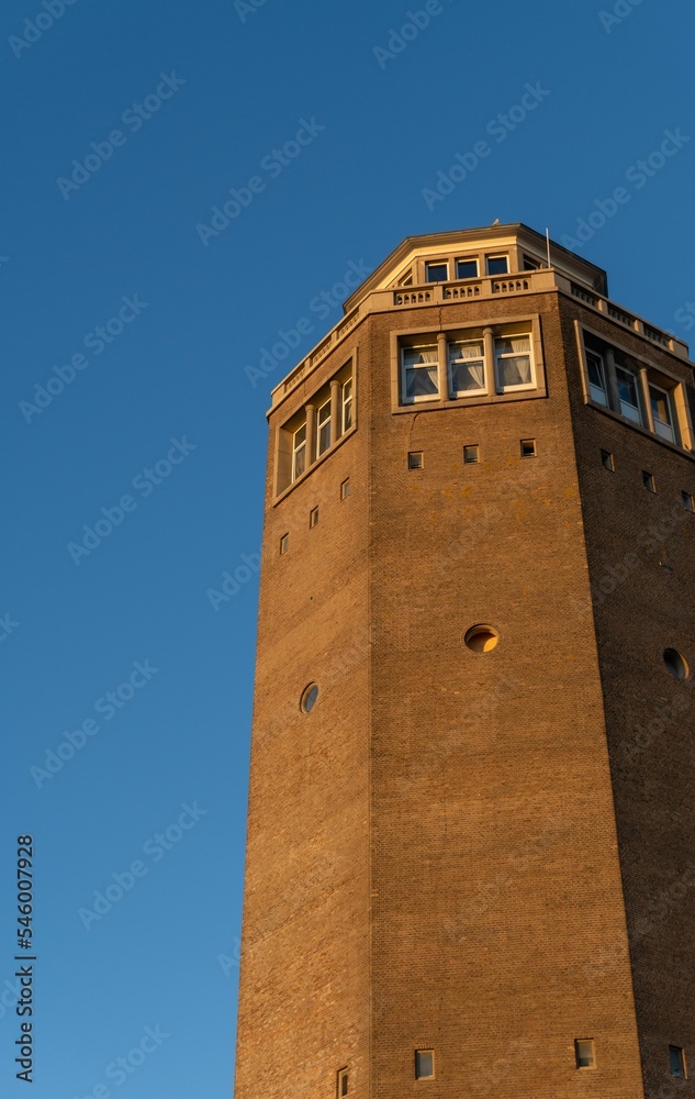 Vertical shot of a water tower in Zandvoort the Netherlands against the clear blue sky