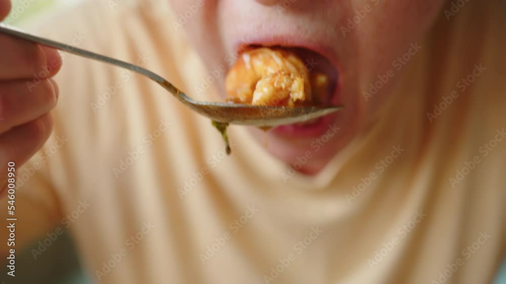 Woman eating Tom Yam soup with shrimps close-up. Woman eating Tom Yam soup with shrimps close-up.