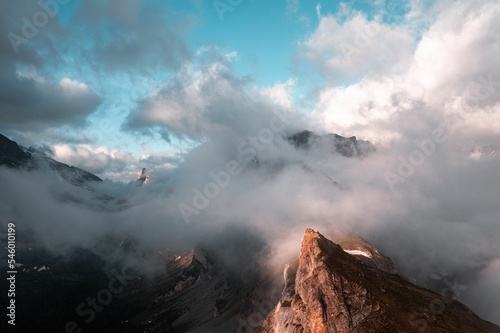 Foggy mountain ridge at sunrise in Bernese Oberland, Gemmi, Switzerland photo