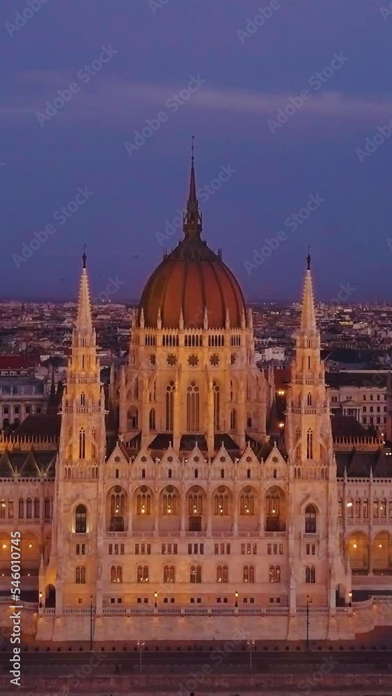 Vertical view of modern buildings at dark night in Budapest, Hungary Vertical view of modern buildings at dark night in Budapest, Hungary