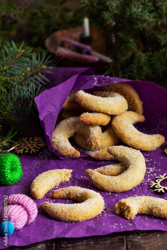 Obraz na płótnie Traditional advent cookies vanilla crescents on a purple background. Rustic style. w salonie