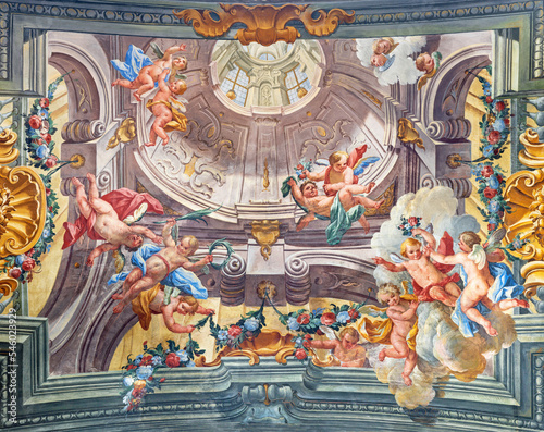 VARALLO, ITALY - JULY 17, 2022: The fresco of baroque angels among the flowers in the church Basilica del Sacro Monte by Francesco Leva (1714).