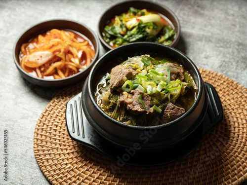 Galbi soup and various side dishes in a hot pot