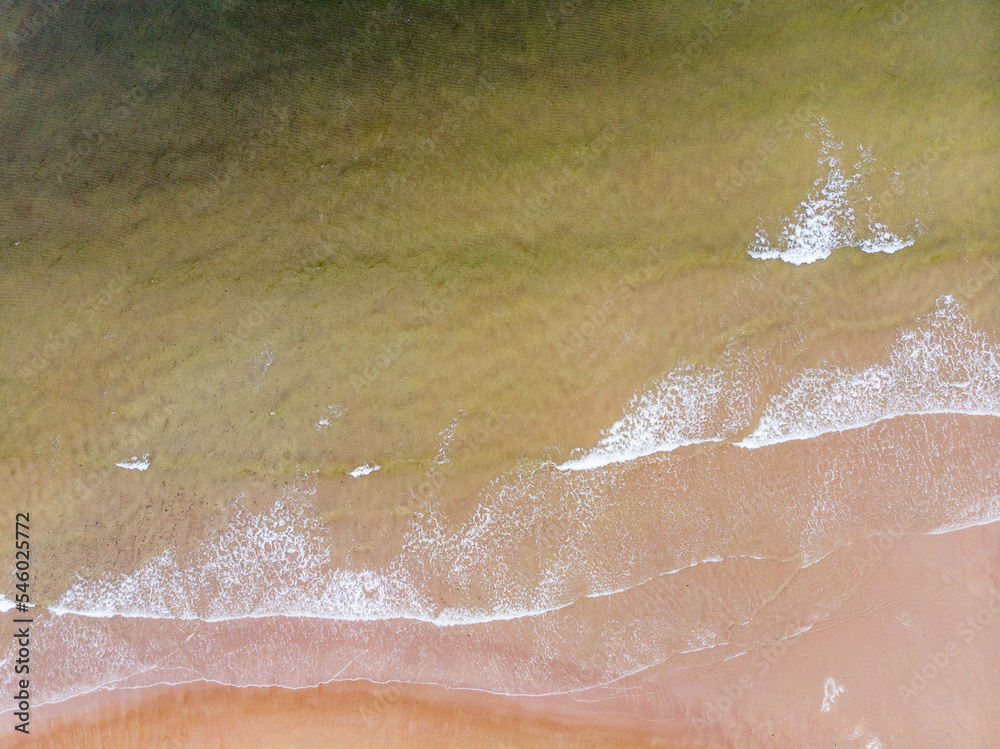 Fototapeta premium Surf line on the sandy beach of the Barents Sea. Teriberka