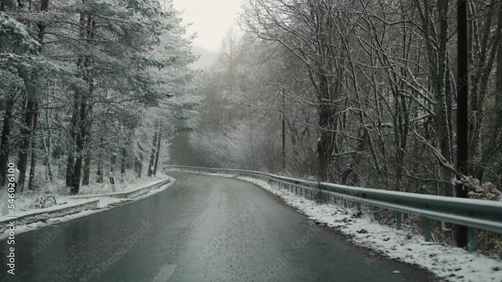 Pov of driving on winter ice rural road in mountain forest Pov of driving on winter ice rural road in mountain forest