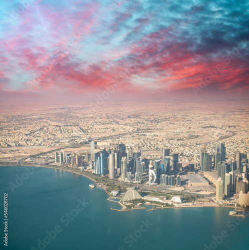 Aerial view of Doha skyline from airplane. Corniche and modern buildings  Qatar