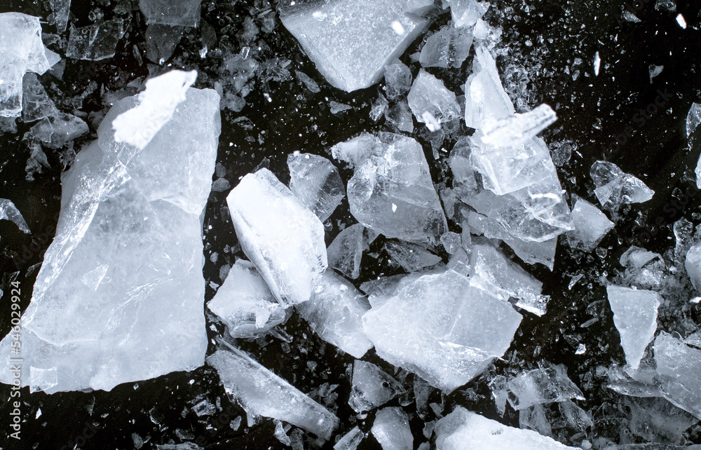 Abstract ice texture. A network of cracks on a piece of blue ice Abstract ice texture. A network of cracks on a piece of blue ice