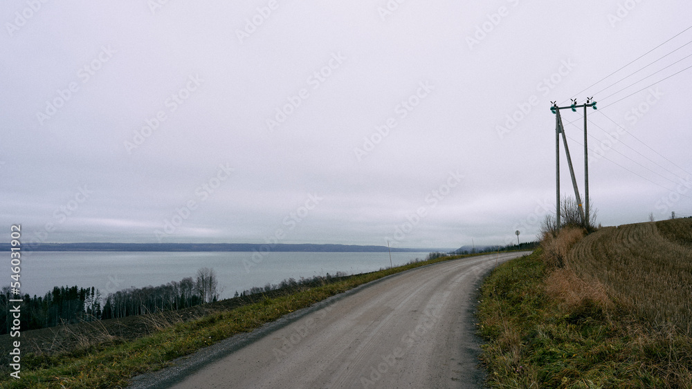 Fototapeta premium A gravel road by Lake Mjøsa.