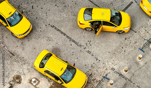 Yellow city taxes, overhead aerial view of yellow cabs.
