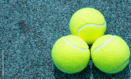 Tennis balls lie on the court